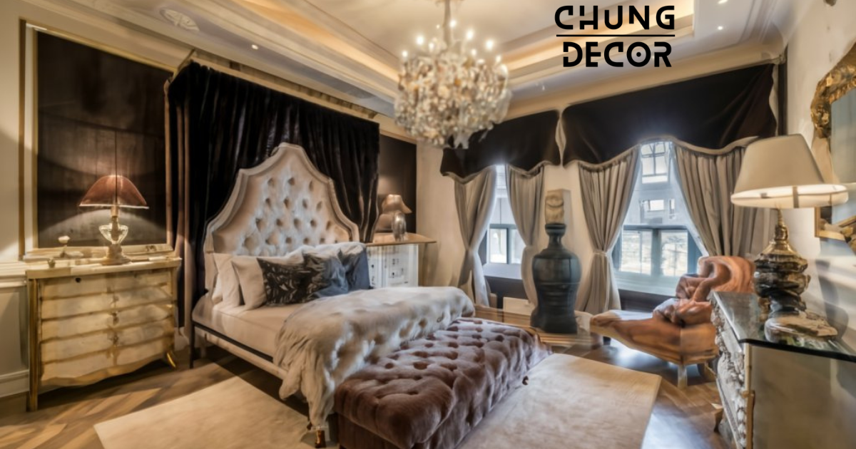 A spacious mansion bedroom furnished with elegant pieces, including a grand canopy bed with intricate carvings and a tufted headboard. A velvet chaise lounge sits gracefully in a corner, adorned with a throw pillow and a faux fur throw blanket. A mirrored dresser with ornate detailing adds a touch of glamour, reflecting the soft glow of the chandelier above.