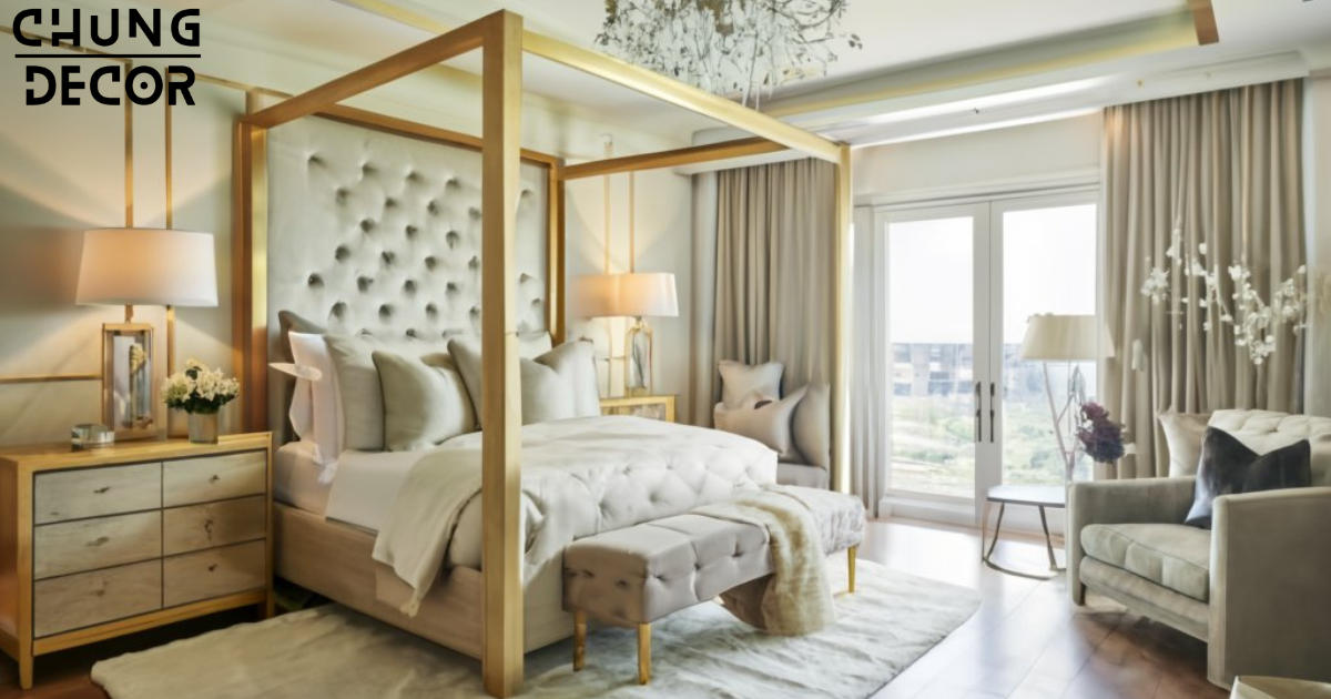 A luxurious canopy bed adorned with plush pillows and sumptuous bedding, featuring rich textures and elegant patterns. The bedding is in shades of ivory and gold, complemented by a faux fur throw blanket draped at the foot of the bed. Crystal bedside lamps provide soft illumination, adding to the opulent ambiance of the room.